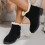 Botas femininas com laço, pretas, em nylon e elastano, cano médio e salto baixo. 6