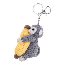 Délicieux singe embrassant la banane porte-clés porte-clés
