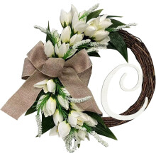 Couronne de porte d'entrée avec nœud papillon et nom de famille