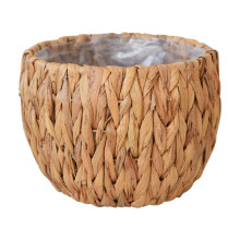 Natuurlijke rotan bloempotten en opbergmanden voor huisdecoratie en -organisatie.