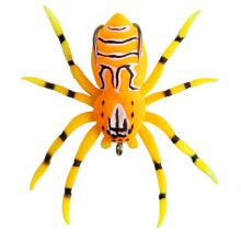 Spider-shaped soft fishing lure orange with barbed hooks