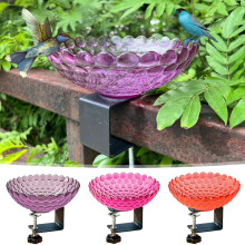 Outdoor bird feeder and bath with fence clamp mount