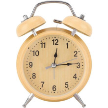 Retro-style mechanical alarm clock with hand-wound metal frame and double bell