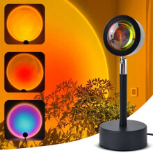 Projecteur d'ambiance RGB avec fond coucher de soleil, télécommande et application Bluetooth.