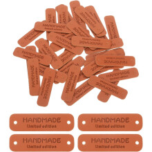 50 Pcs Handmade Leather Labels, PU Leather Handmade Tags Button with Hole Embossed Tag for Embellishment DIY Sewing Crafts, 55x15mm, Dark Brown