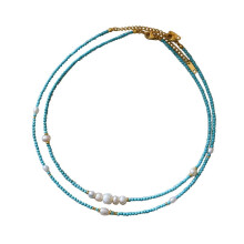 Modieuze en eenvoudige turquoise zoetwaterparelketting, veelzijdig en geschikt voor een nichemarkt, hoogwaardige stapelketting voor het sleutelbeen.