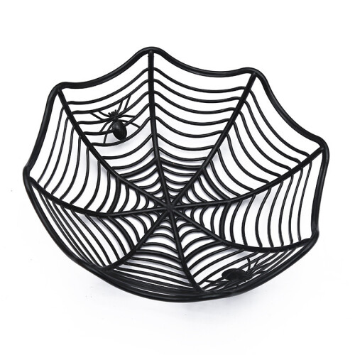 A black spider web-shaped plastic fruit and candy basket for Halloween, a table party decoration.