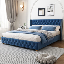 Cama tapizada de terciopelo azul 160x200 con somier de lamas y cabecero con clavos.