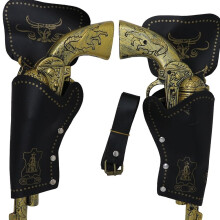 Double Holster cowboy with bronze-colored plastic guns
