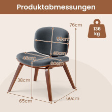 Donkergrijze fauteuil met gebogen rugleuning en gewatteerde zitting.