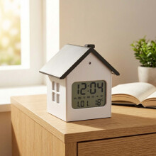 Digitale wekker in de vorm van een huis met lcd-scherm