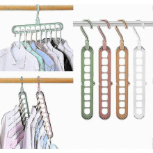 Magic Space Savers: 4-Pack Smart Clothes Hangars, 9-Slot Organizer - Innovative Design for Premium Wardrobe Storage!