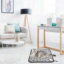 Tappetino riscaldante per animali domestici con temperatura regolabile, sicuro per cani e gatti, conforme agli standard di sicurezza.