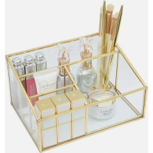 Vintage gouden glazen make-upborstelhouder en opbergbakje voor nagellak, lippenstift en andere beautytools.