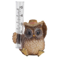 Pluviomètre en forme de hibou avec tube de mesure transparent, idéal pour la décoration de jardin et de terrasse. Fabriqué en résine.