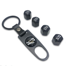 Set van 4 zwarte Range Rover ventieldopjes met sleutelhanger en vergrendelingsmechanisme.