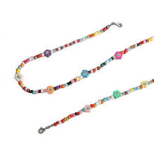 Conjunto de collar y pulsera de cuentas de arcilla de resina de colores vibrantes.