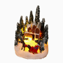 Decoraciones navideñas: casa de resina, adornos luminosos para el árbol de Navidad.
