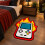 (70*100cm) 1pc Retro Handheld Flame Pattern Irregular Carpet, Red And Yellow Flame Game Console Shaped Creative Floor Mat, Trendy 1